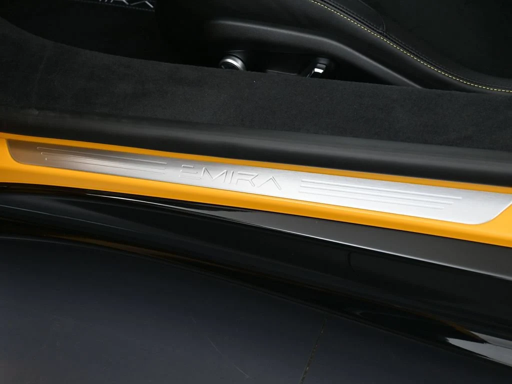2025 Lotus Emira V6 interior, door sill, Black Alcantara with Yellow Stitch