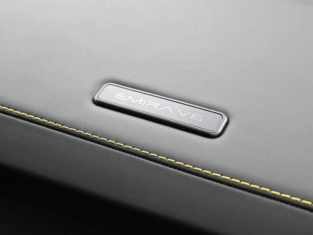 2025 Lotus Emira V6 interior, door sill, Black Alcantara with Yellow Stitch