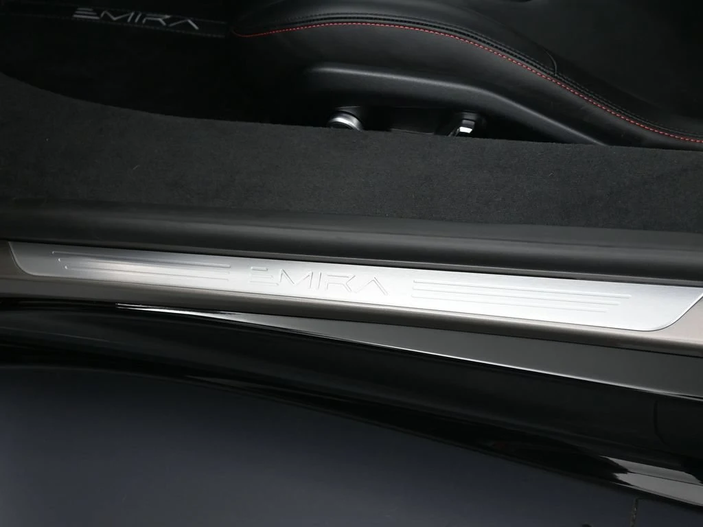 2026 Lotus Emira Turbo SE interior, door sill, Black Leather with Red Accents