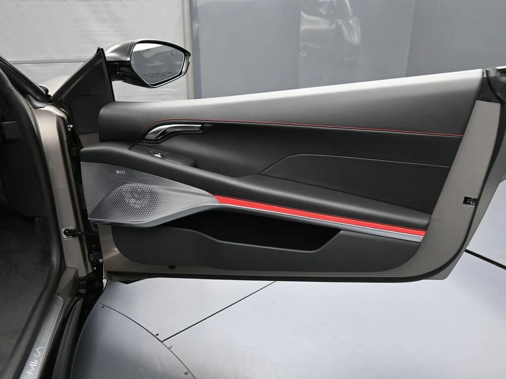 2026 Lotus Emira Turbo SE interior, door panel, Black Leather with Red Accents