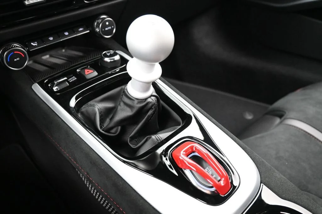 2026 Lotus Emira V6 SE Racing Line interior, center console, Black with Red Accents