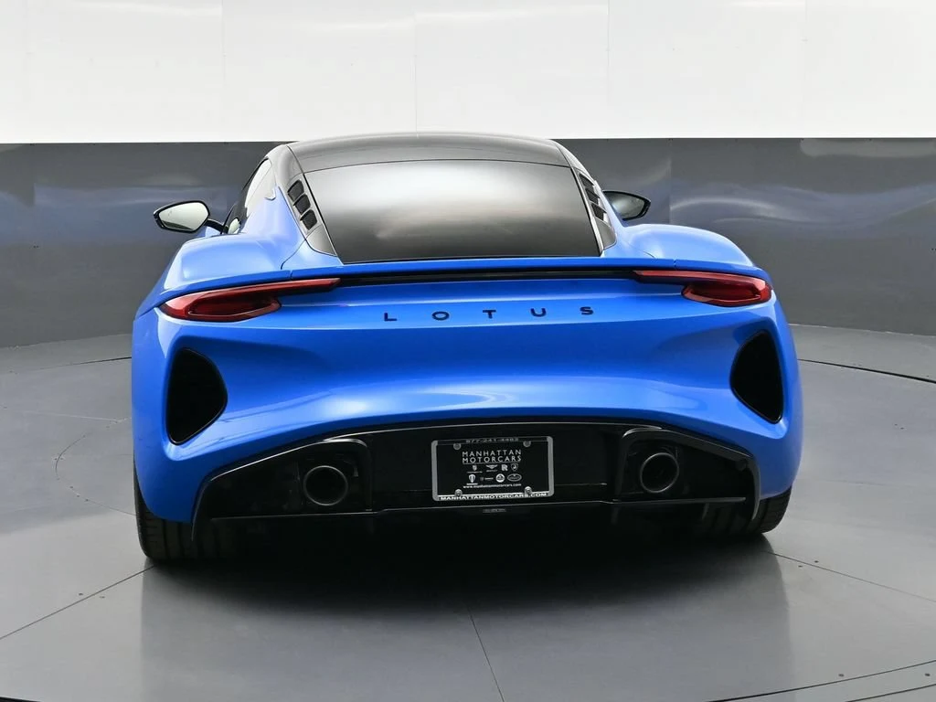 2026 Lotus Emira V6 SE, rear three-quarter view, Blue
