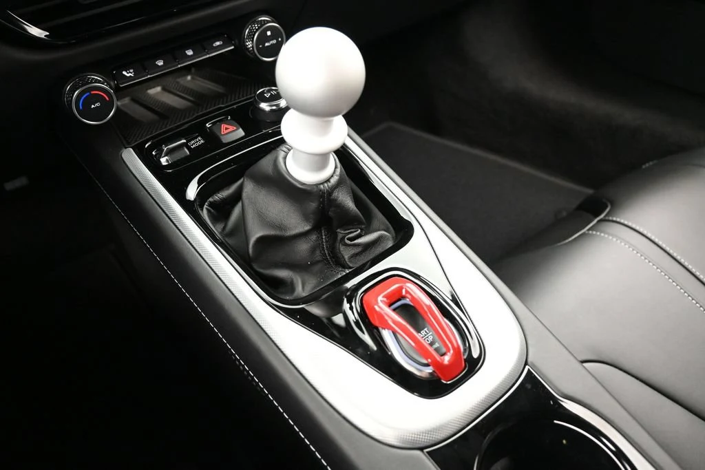 2026 Lotus Emira V6 SE interior, center console, Black with Yellow Accents