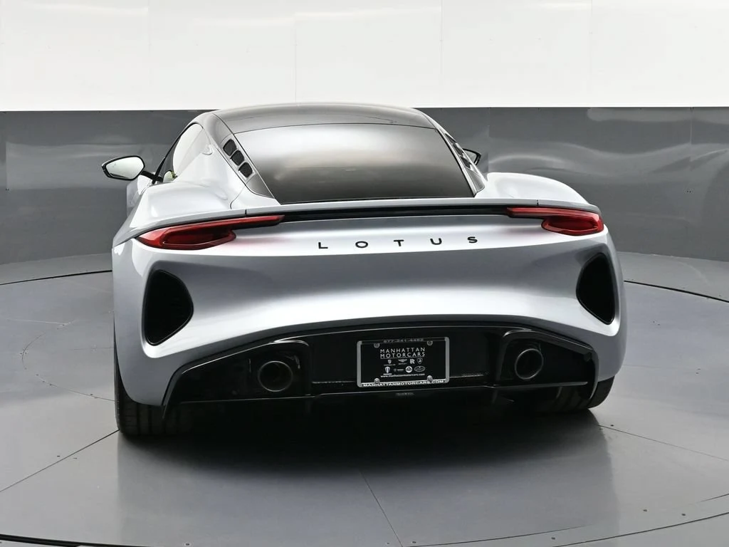 2026 Lotus Emira V6 SE, rear three-quarter view, Silver