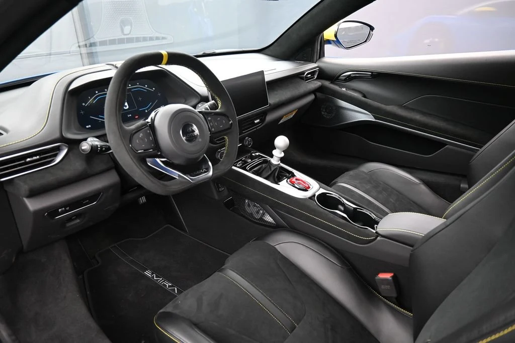 2026 Lotus Emira V6 interior, dashboard, Black with Yellow Stitch