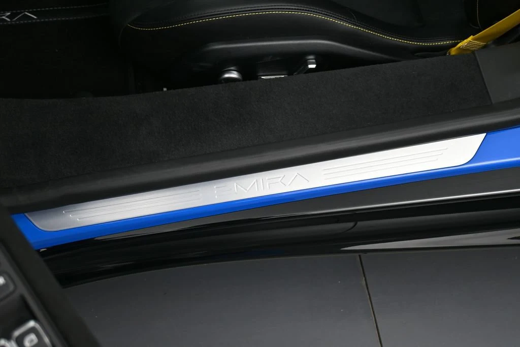 2026 Lotus Emira V6 interior, door sill, Black with Yellow Stitch