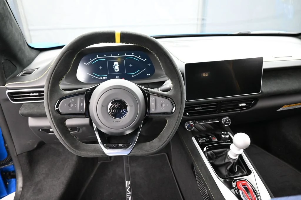 2026 Lotus Emira V6 interior, dashboard, Black with Yellow Stitch