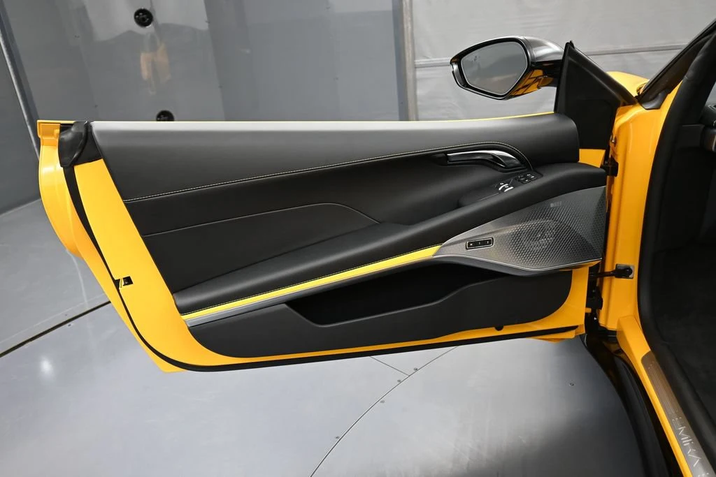 2026 Lotus Emira Turbo SE interior, door panel, Black with Yellow Stitch