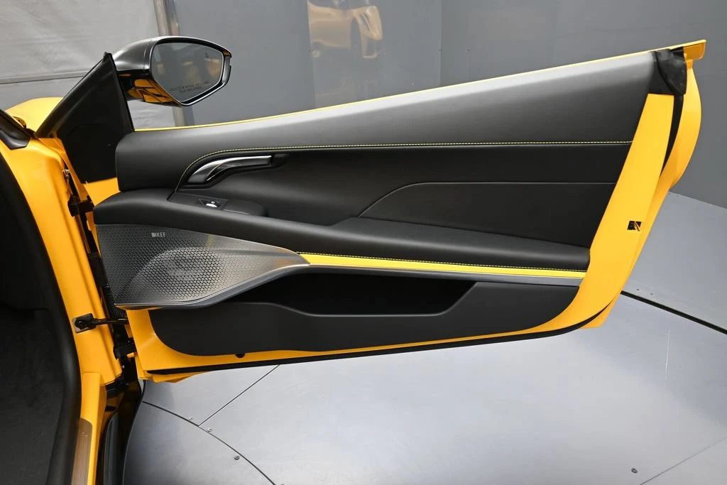 2026 Lotus Emira Turbo SE interior, door panel, Black with Yellow Stitch