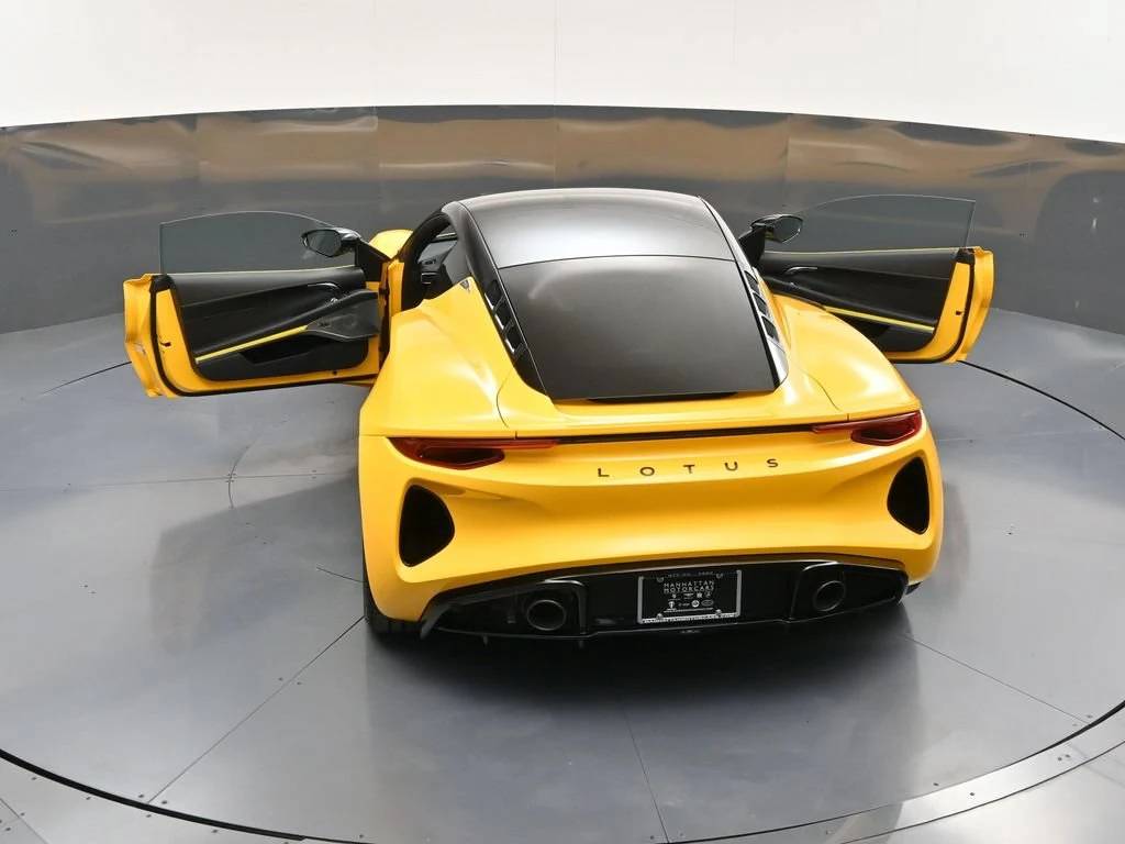 2026 Lotus Emira Turbo SE, rear three-quarter view, Yellow