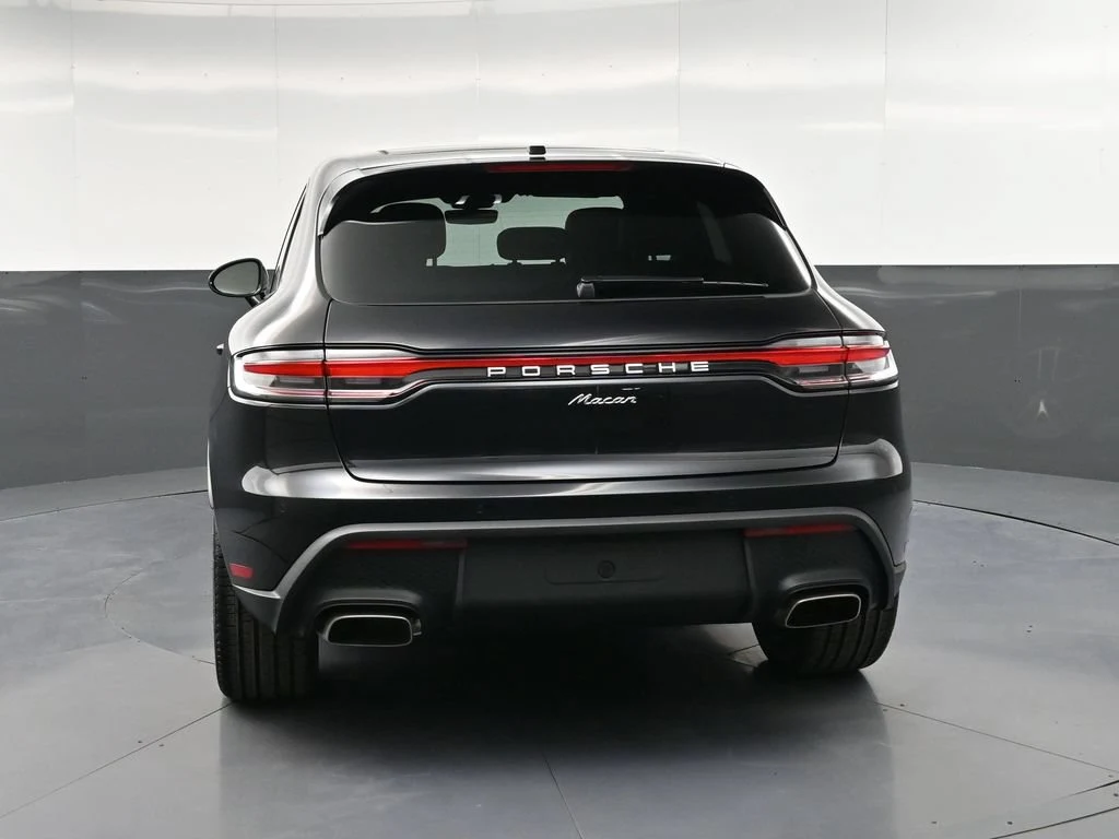 2026 Porsche Macan, rear three-quarter view, Black