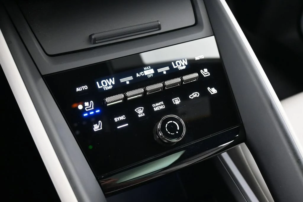 2025 Porsche Macan Turbo Electric interior, center console, Black/Chalk