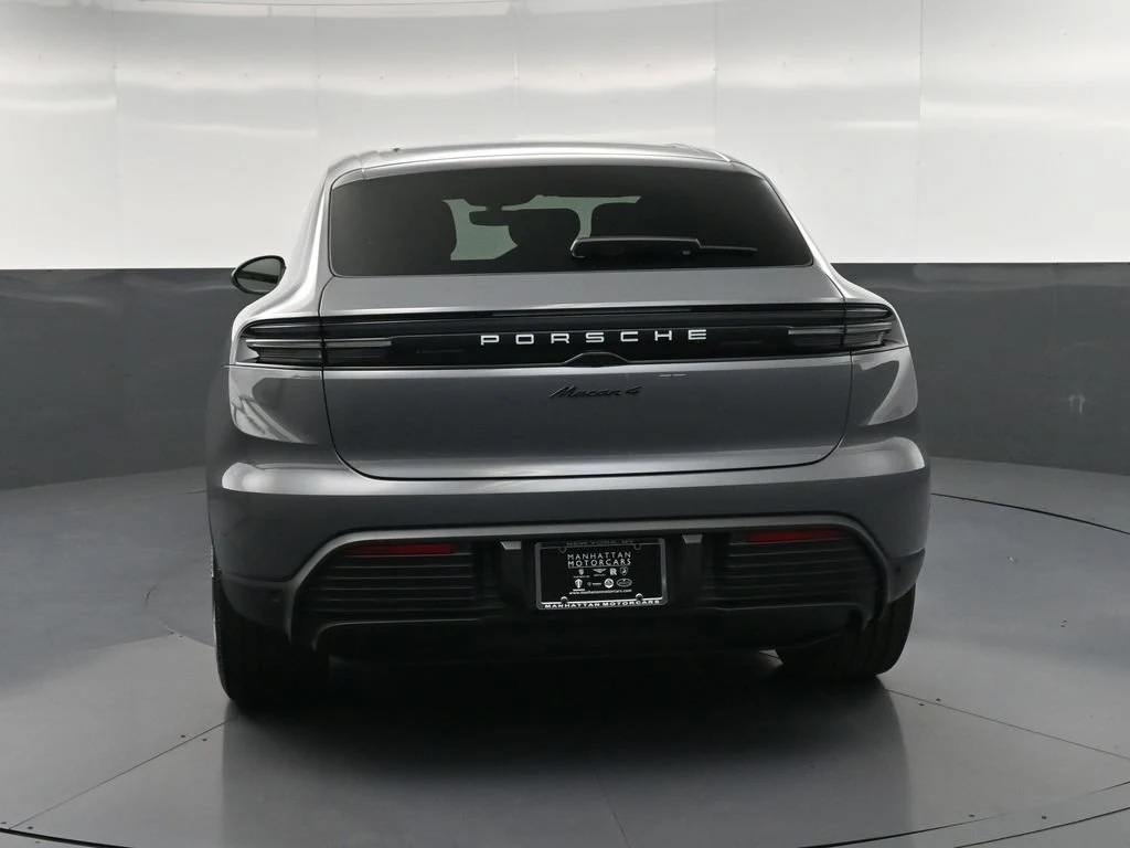 2026 Porsche Macan 4 Electric, rear three-quarter view, Grey