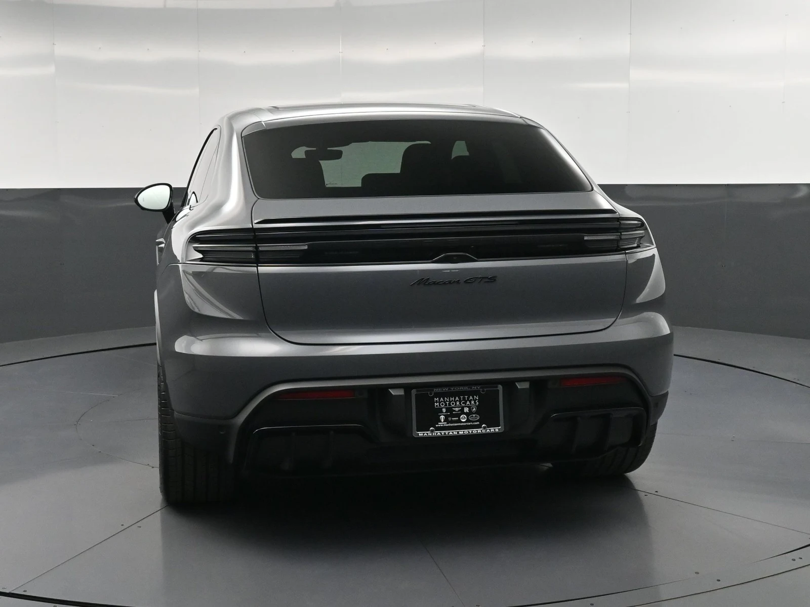 2026 Porsche Macan GTS Electric, rear three-quarter view, Grey