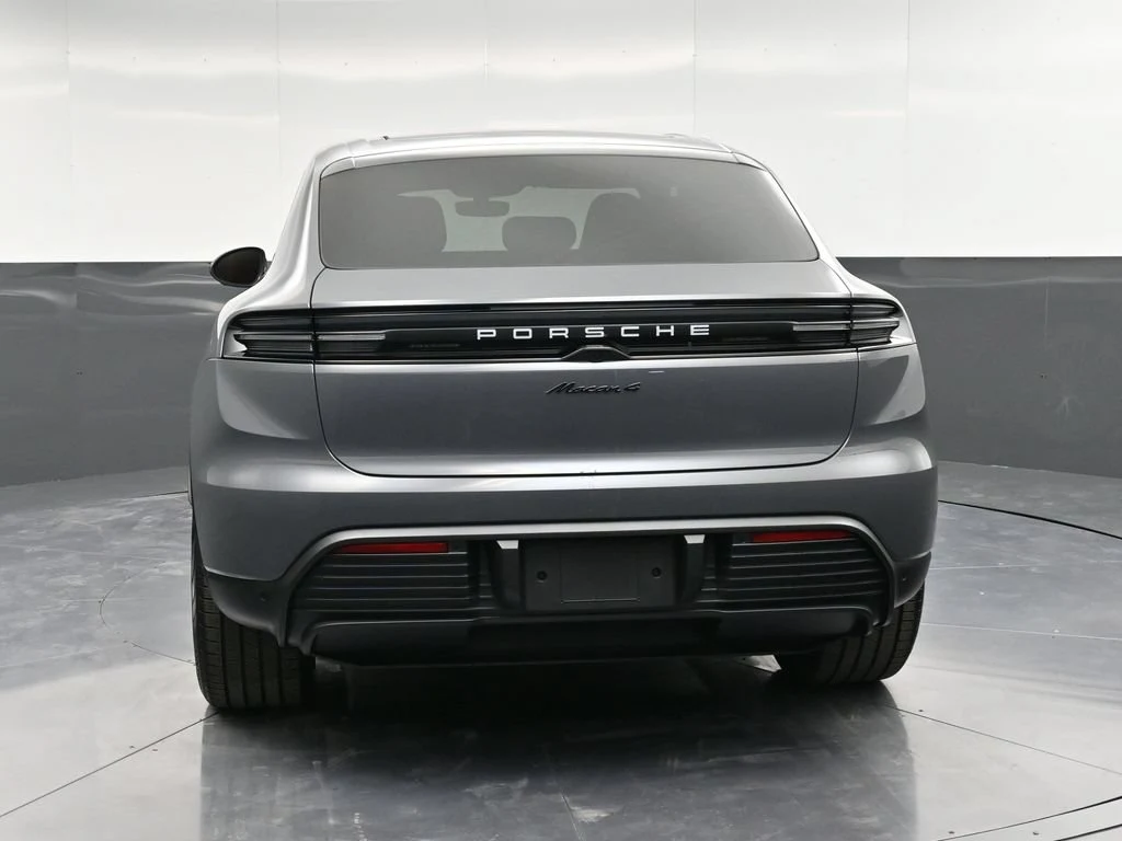 2026 Porsche Macan 4 Electric, rear three-quarter view, Grey