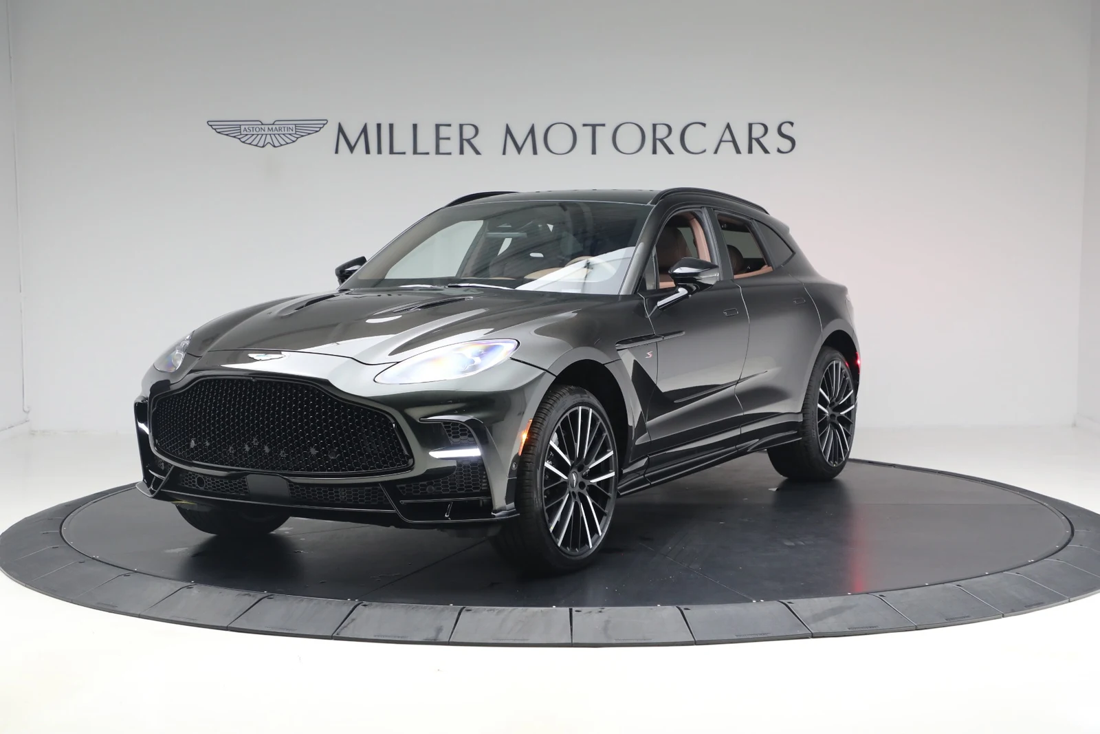 2026 Aston Martin DBX S, Minotaur Green, complete car from a front three-quarter angle