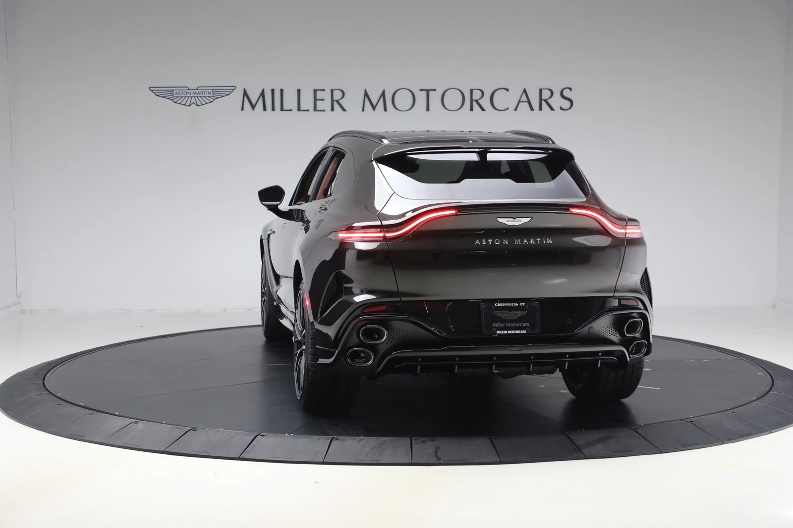 2026 Aston Martin DBX S, rear three-quarter view, Minotaur Green