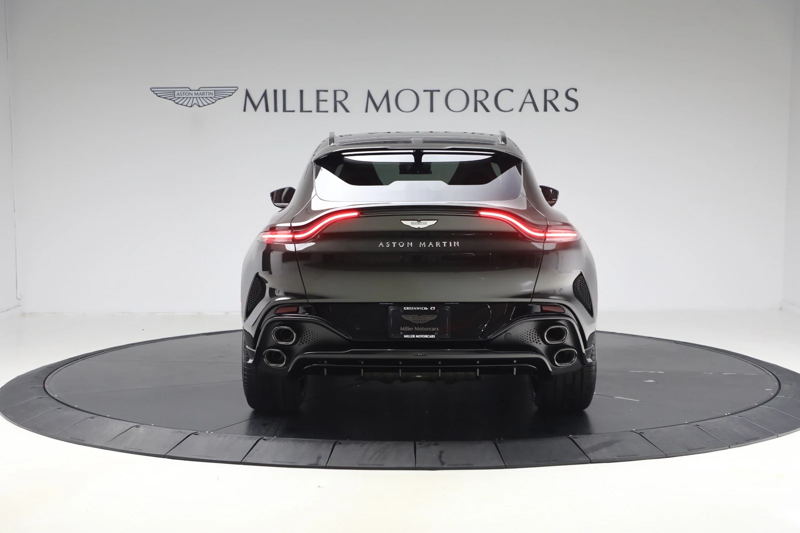 2026 Aston Martin DBX S, rear three-quarter view, Minotaur Green