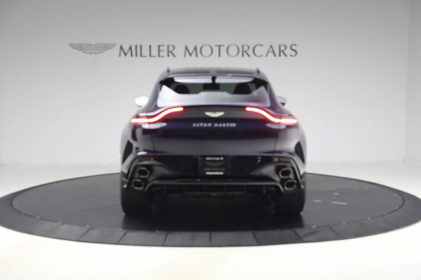2026 Aston Martin DBX S, rear three-quarter view, Midnight Blue