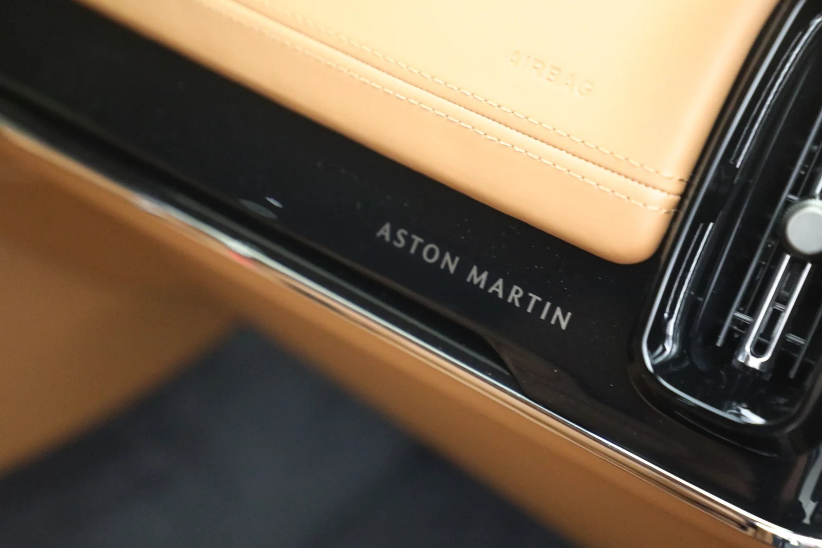 2026 Aston Martin DBX S interior, door sill, Centenary Saddle Tan