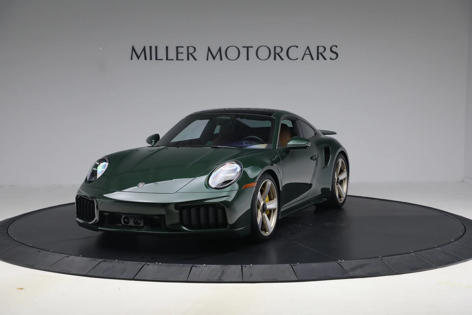 2026 Porsche 911 Turbo S, Oak Green Metallic Neo, complete car from a front three-quarter angle