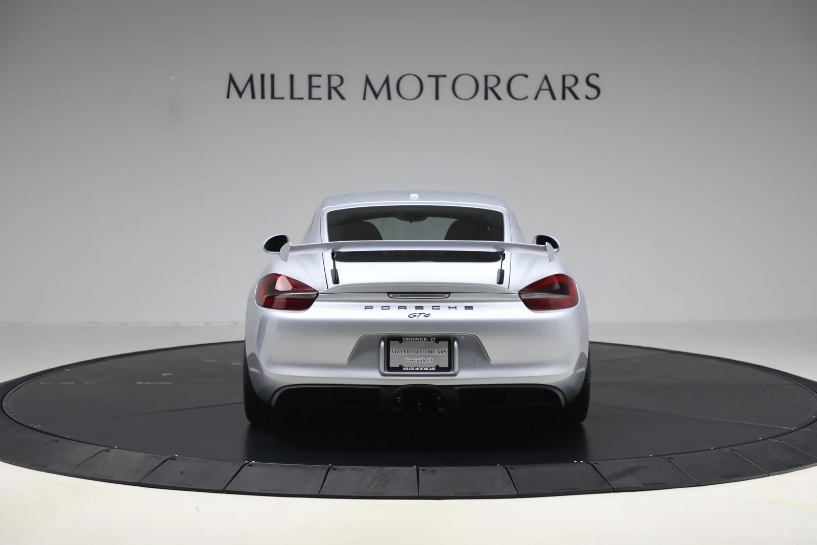 2016 Porsche Cayman GT4, rear three-quarter view, Rhodium Silver Metallic