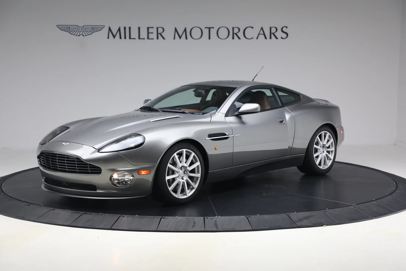 2006 Aston Martin V12 Vanquish S, Tungsten Silver, complete car from a front three-quarter angle