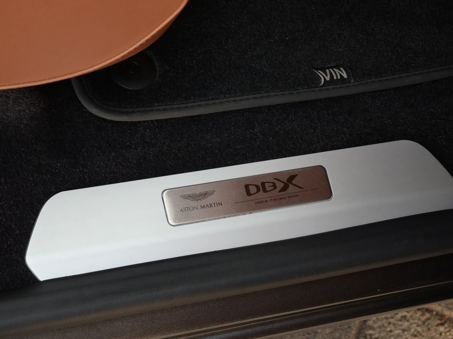 2023 Aston Martin DBX707 interior, door sill, Copper Tan Metallic