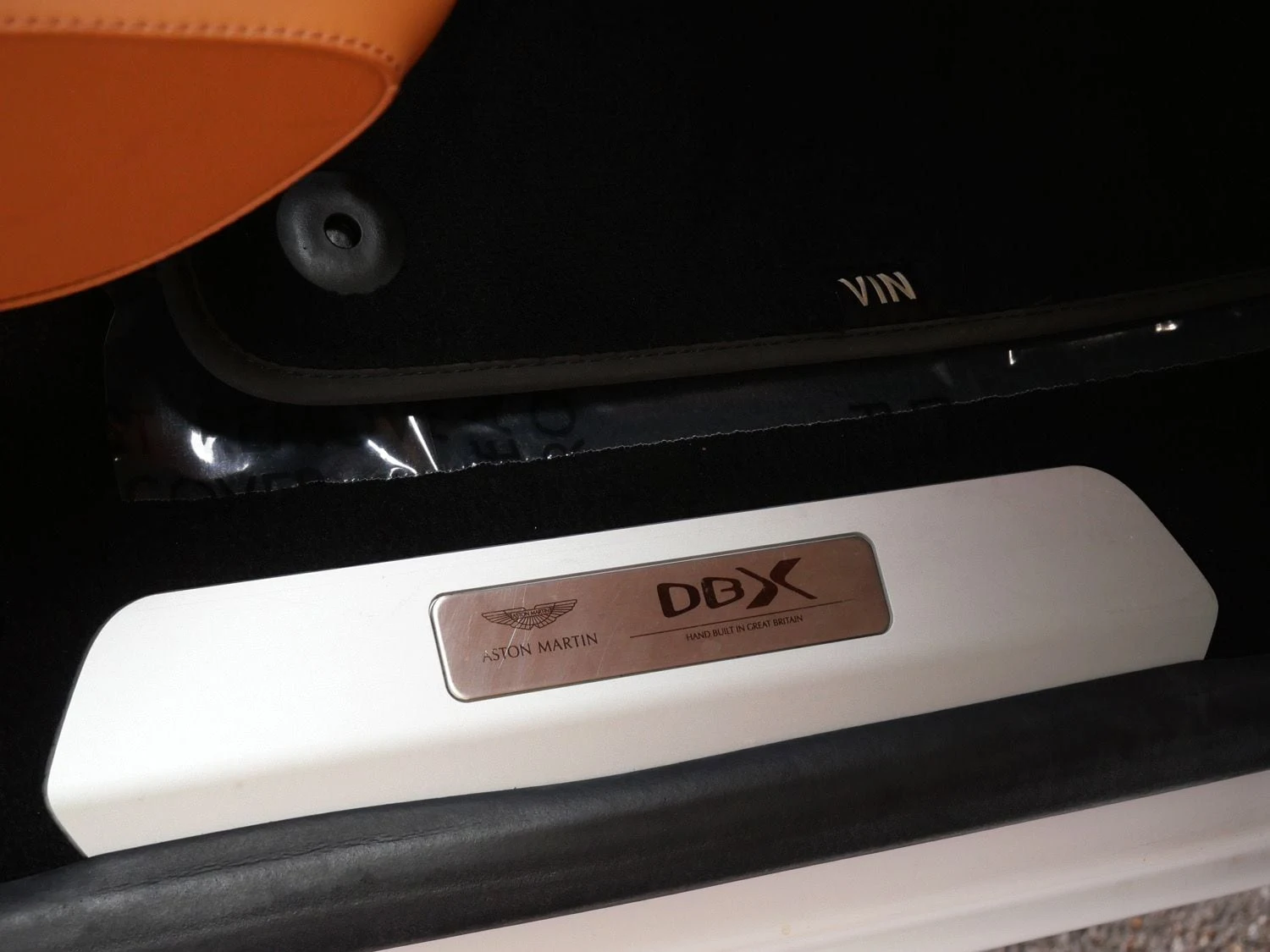2023 Aston Martin DBX interior, door sill, Oxford Tan