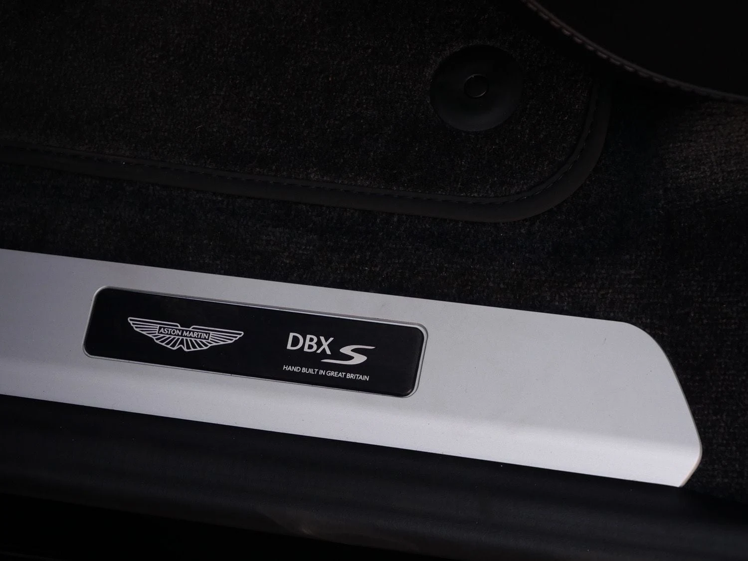 2026 Aston Martin DBX S interior, door sill, Onyx Black - Semi Aniline