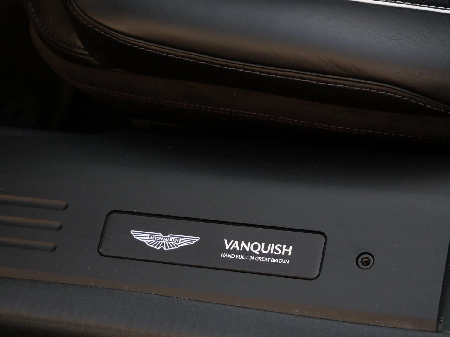 2026 Aston Martin Vanquish Volante interior, door sill, Onyx Black - Semi Aniline / On