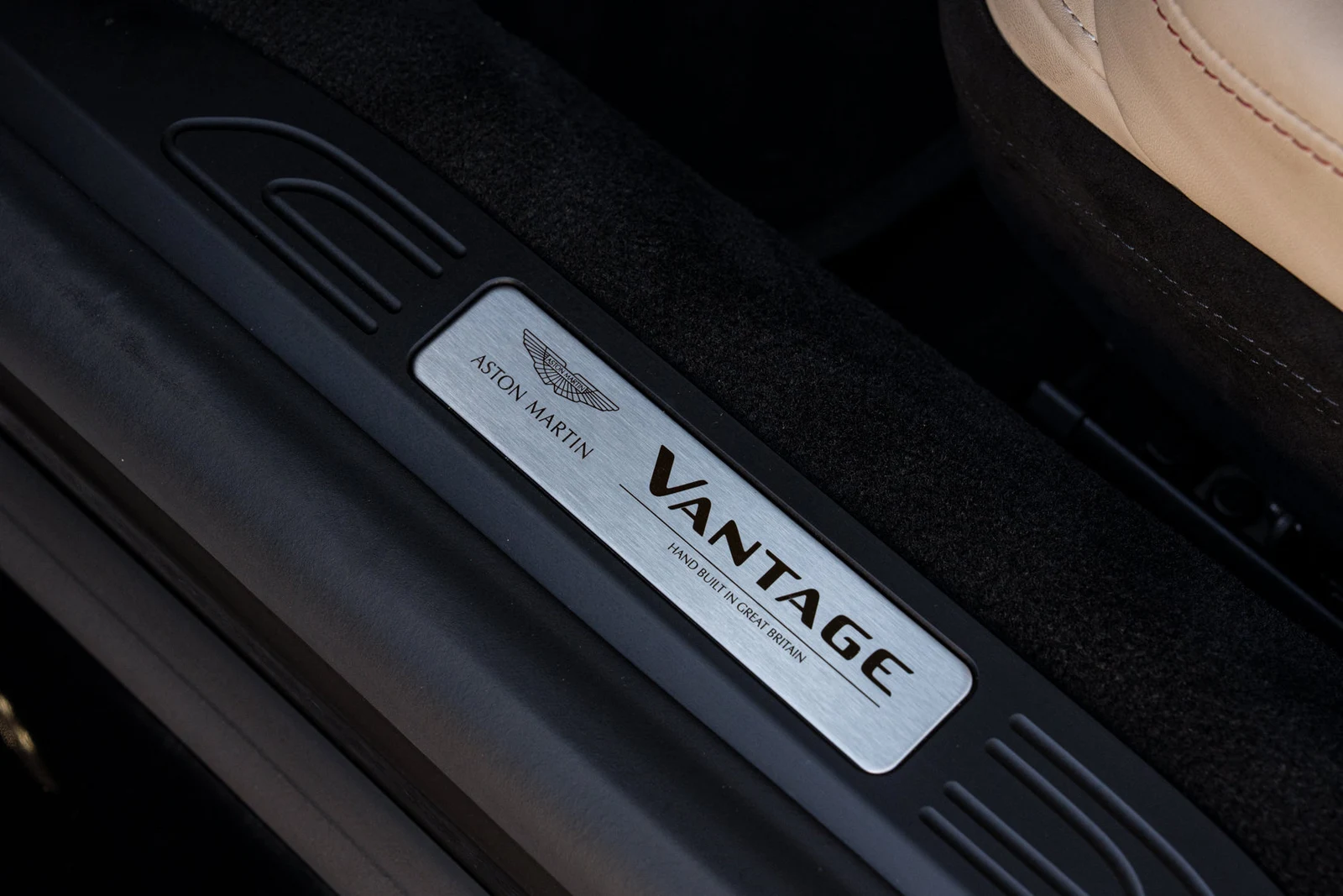 2023 Aston Martin Vantage Roadster interior, door sill, Onyx Black/Sandstorm