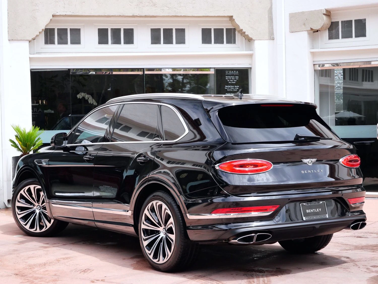 2022 Bentley Bentayga V8, rear three-quarter view, Black