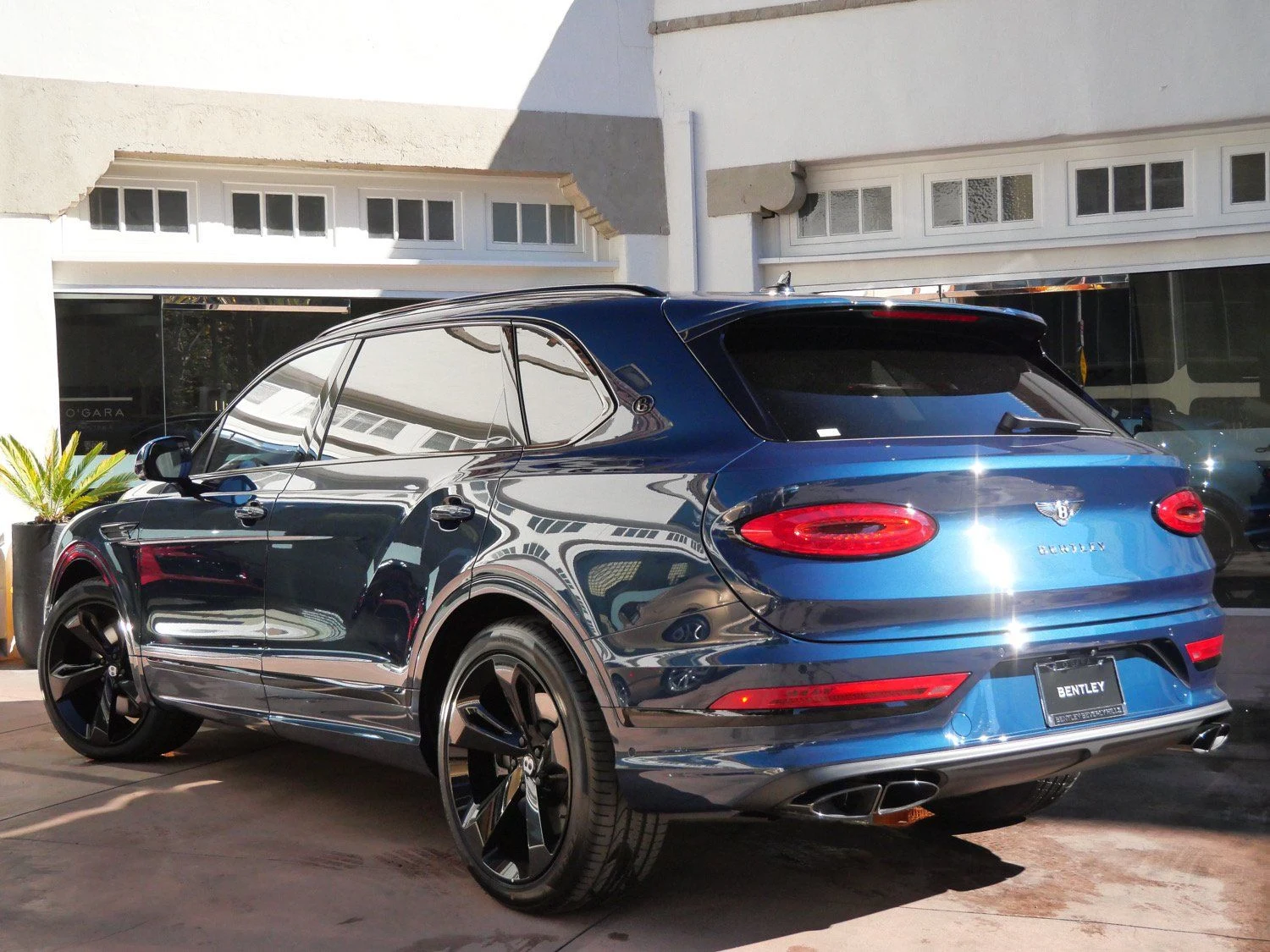 2025 Bentley Bentayga EWB, rear three-quarter view, Blue
