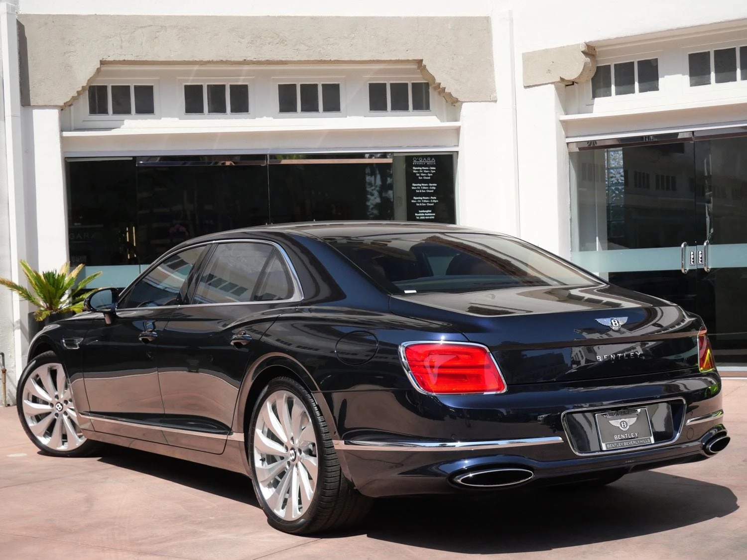 2026 Bentley Flying Spur, rear three-quarter view, Blue