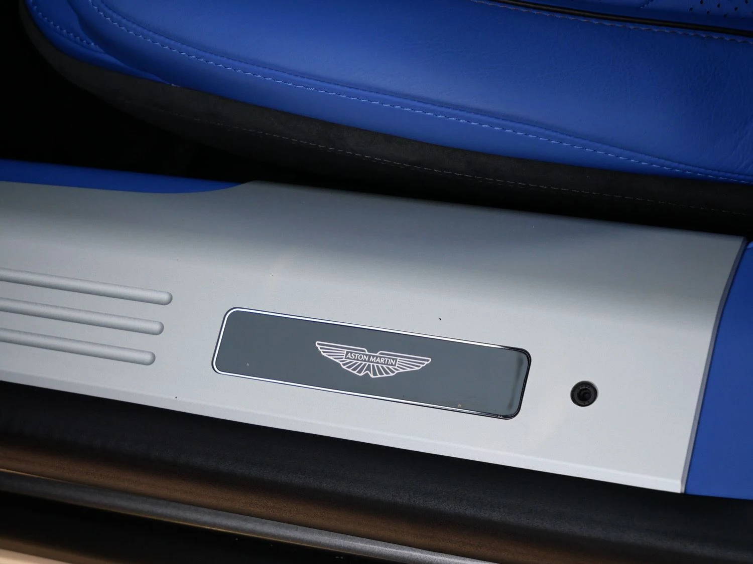 2026 Aston Martin DB12 S interior, door sill, Cote D Azur Blue - Semi Aniline