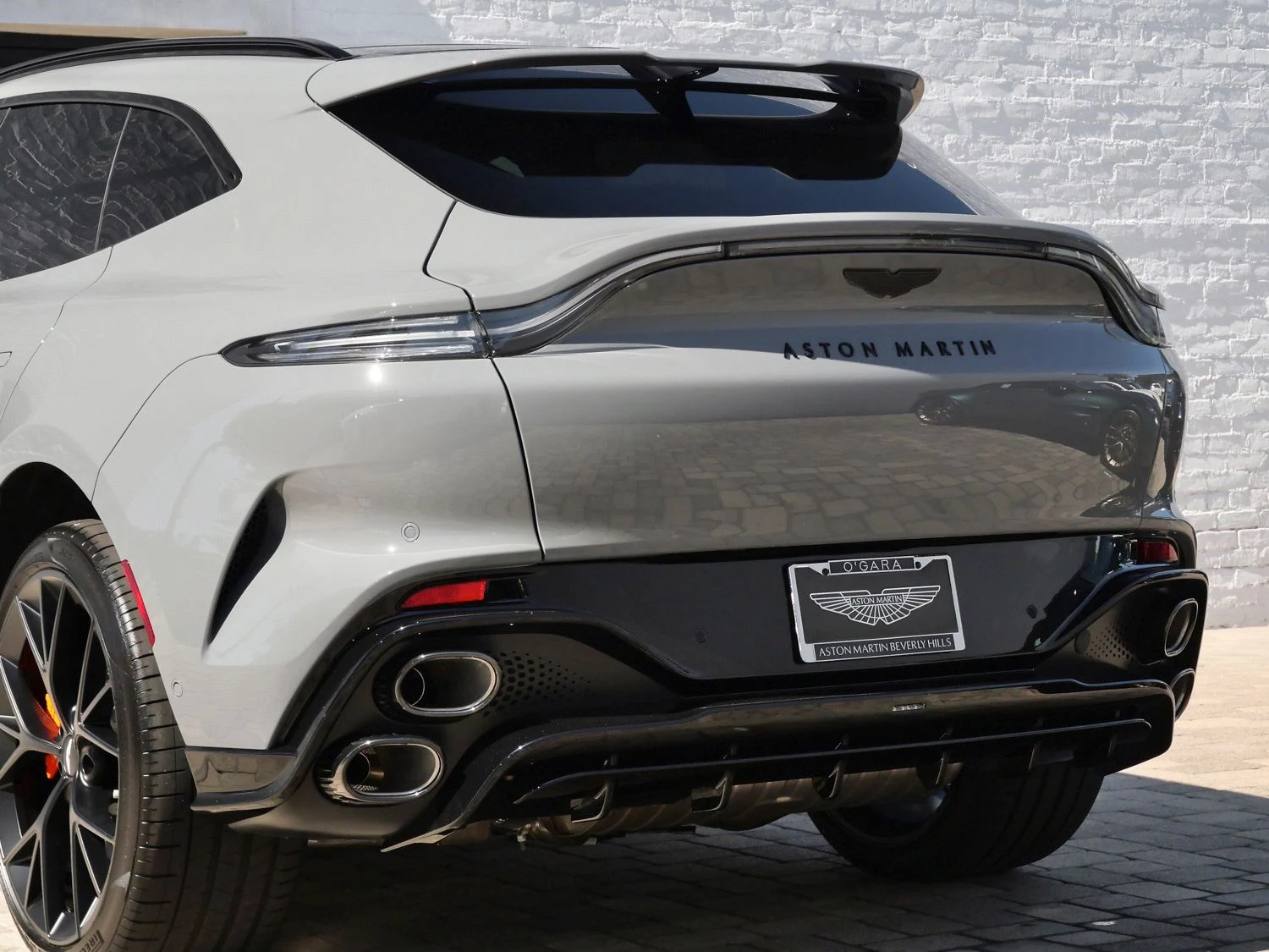 2026 Aston Martin DBX S, rear three-quarter view, Grey