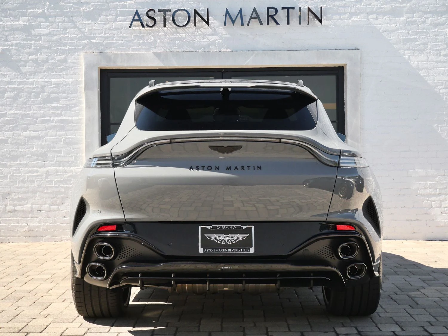 2026 Aston Martin DBX S, rear three-quarter view, Grey