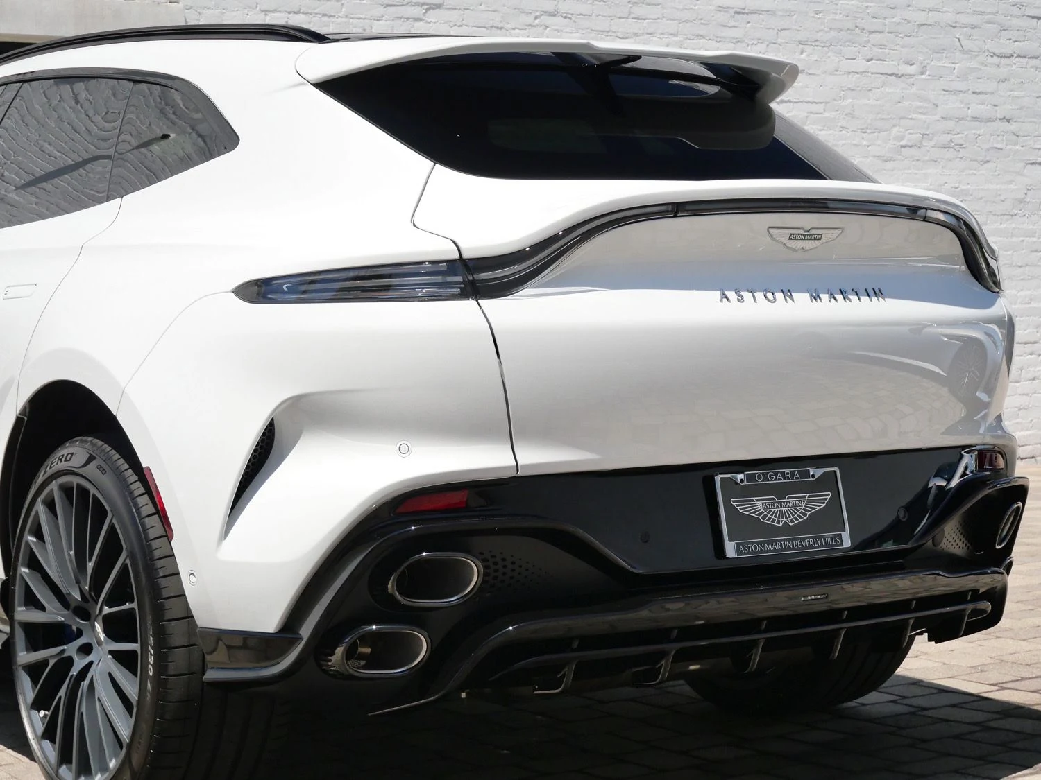 2026 Aston Martin DBX S, rear three-quarter view, White