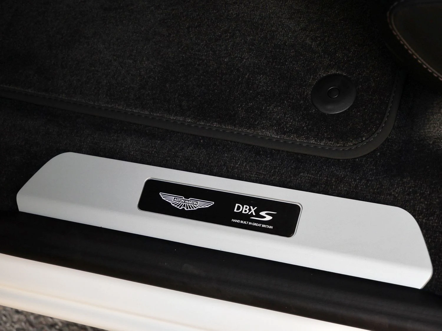 2026 Aston Martin DBX S interior, door sill, Onyx Black - Semi Aniline