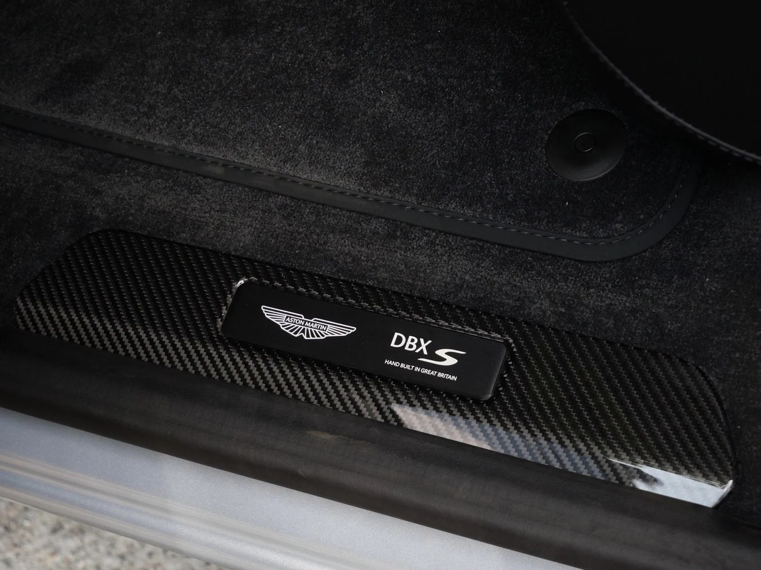 2026 Aston Martin DBX S interior, door sill, Onyx Black - Semi Aniline