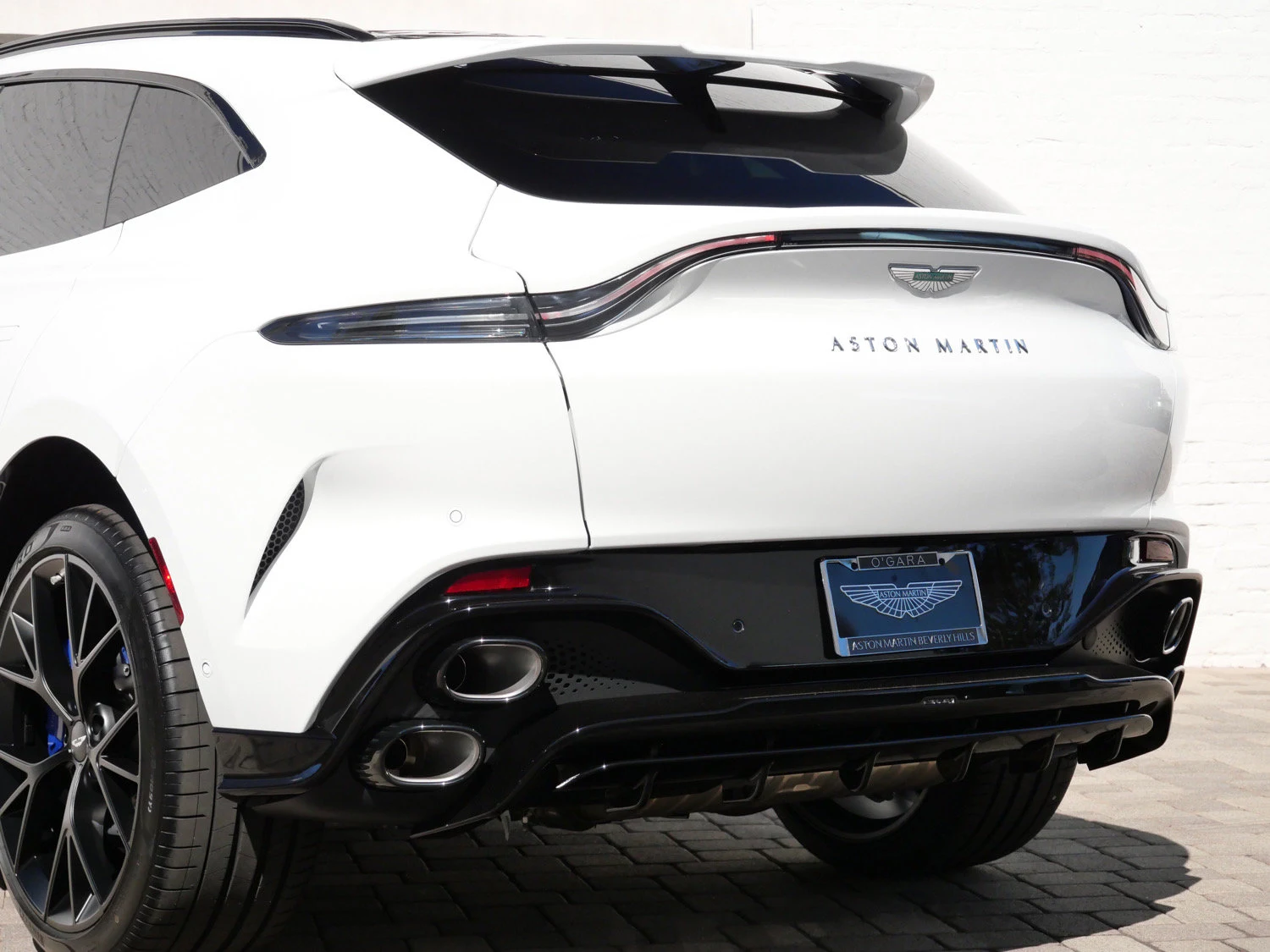 2026 Aston Martin DBX S, rear three-quarter view, White