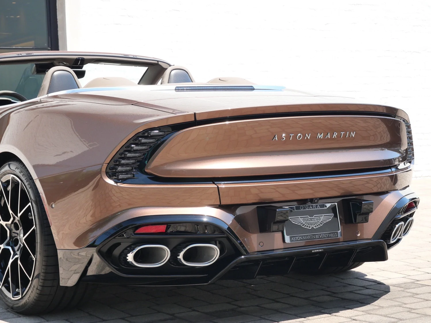 2026 Aston Martin Vanquish Volante, rear three-quarter view, Brown