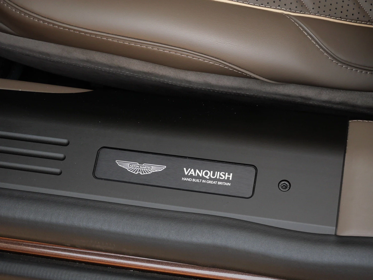 2026 Aston Martin Vanquish Volante interior, door sill, Bison Brown