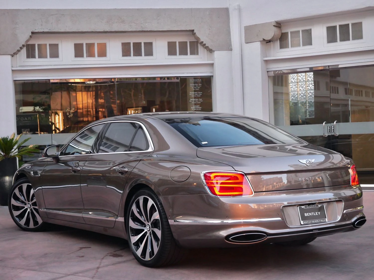 2026 Bentley Flying Spur, rear three-quarter view, Beige
