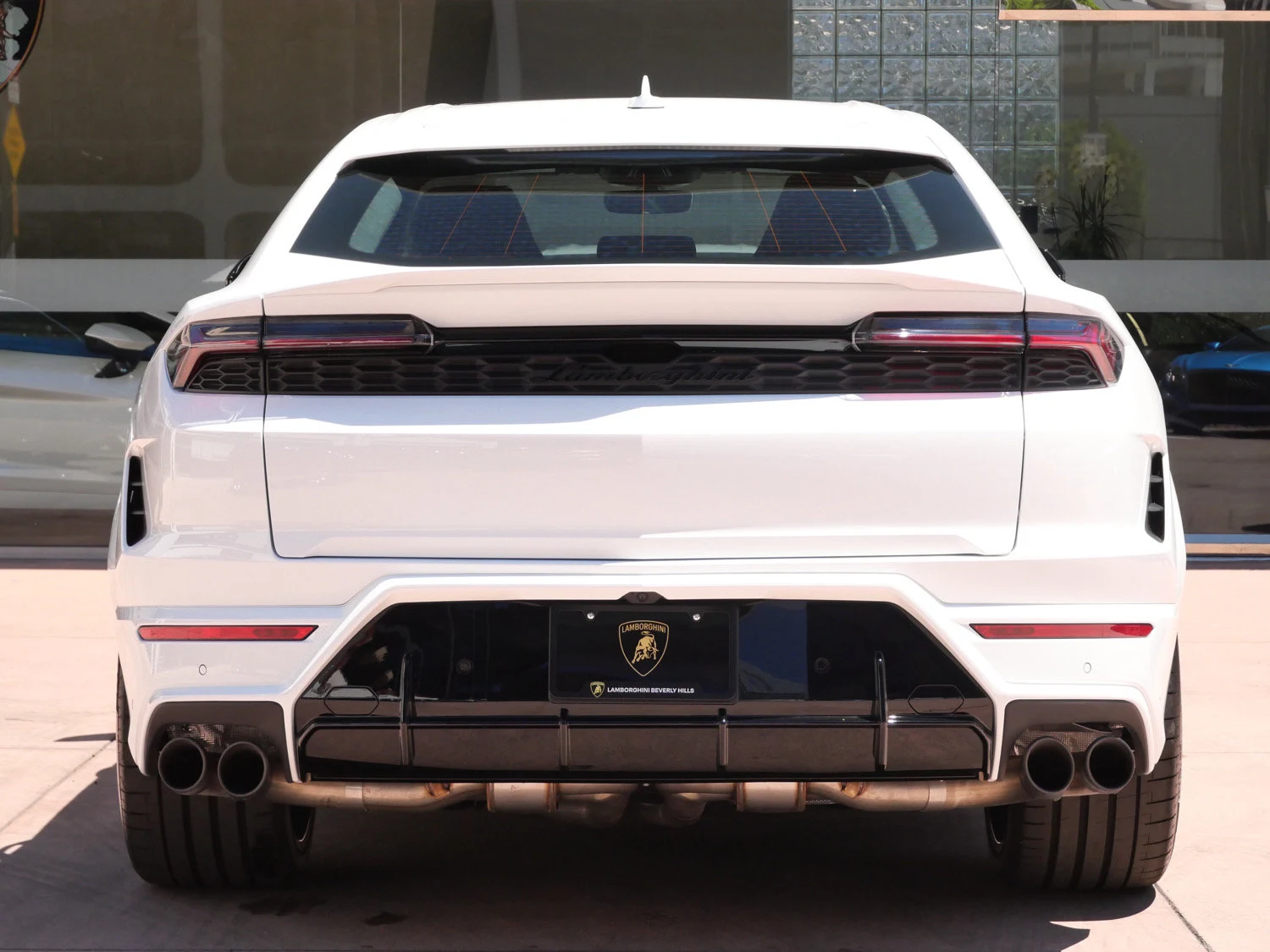 2026 Lamborghini Urus SE, rear three-quarter view, White