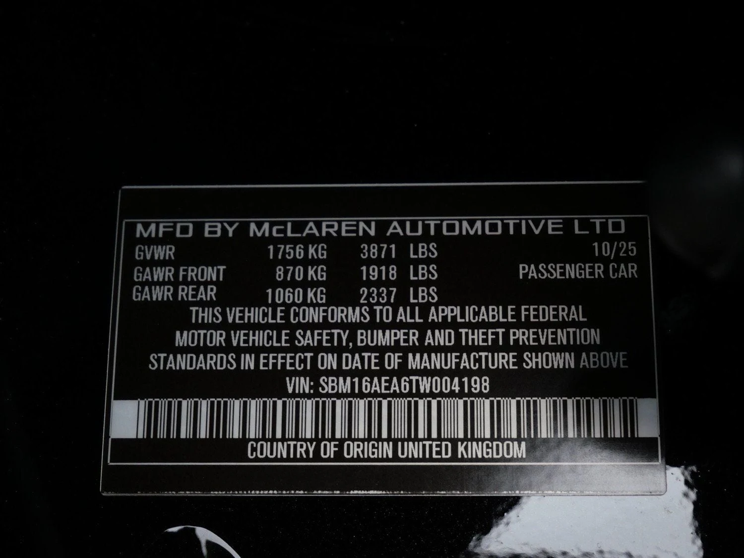 2026 McLaren Artura interior, door sill, Carbon Black