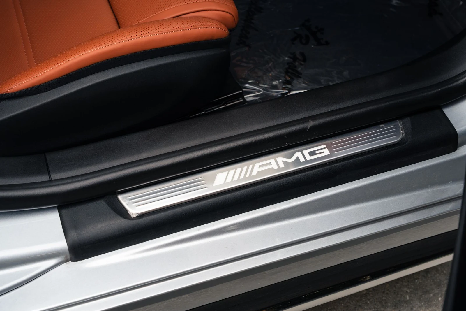2025 Mercedes-AMG GT 63 interior, door sill, Sienna Brown/Black