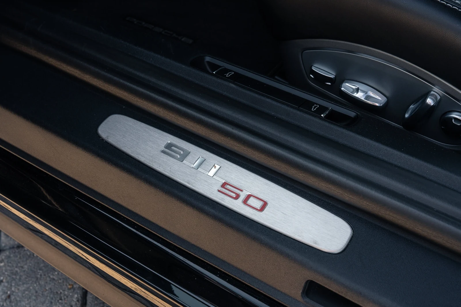 2014 Porsche 911 50th Anniversary Edition interior, door sill, Black