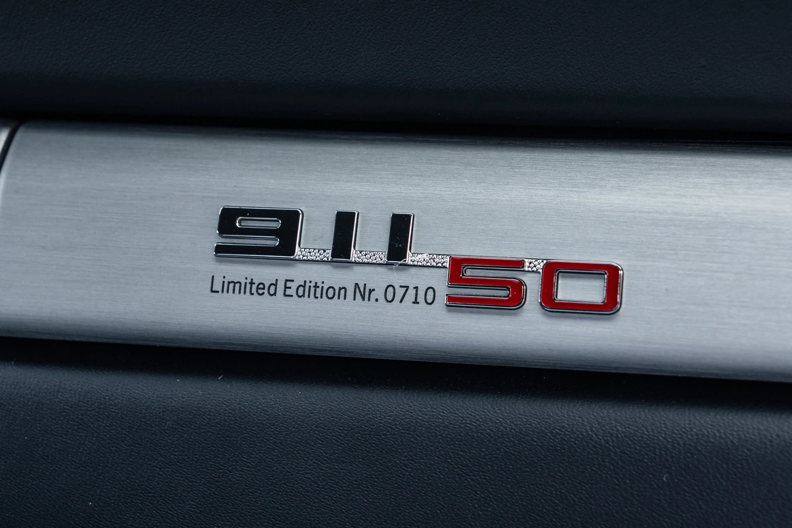 2014 Porsche 911 50th Anniversary Edition interior, door sill, Black